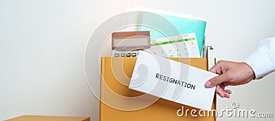 Resignation, Layoff, Unemployment, Dismiss, Job quit, Jobless and Farewell concept. Businessman holding letter of Resign contract Stock Photo