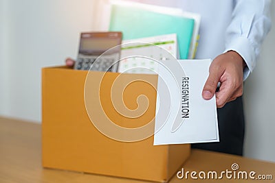 Resignation, Layoff, Unemployment, Dismiss, Job quit, Jobless and Farewell concept. Businessman holding letter of Resign contract Stock Photo