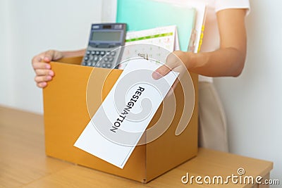 Resignation, Layoff, Unemployment, Dismiss, Job quit, Jobless and Farewell concept. Businesswoman holding letter of Resign Stock Photo