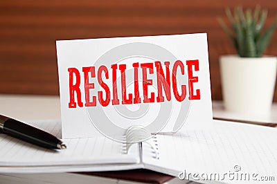 Resilience written on notepad on a table Stock Photo