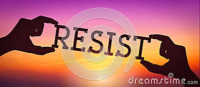 Resist - human hands holding black silhouette word Stock Photo