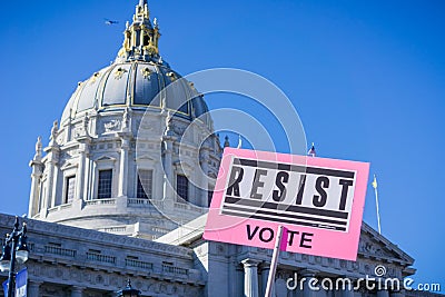 `Resist` sign raised at the Women`s March rally which took place in the Civic Center Plaza Editorial Stock Photo