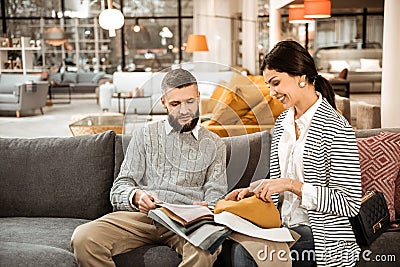 Resolute good-looking married couple deciding on equipment Stock Photo