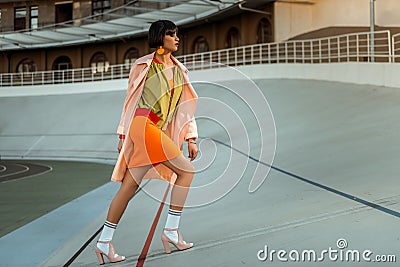 Resolute strong independent female stepping in bright future Stock Photo