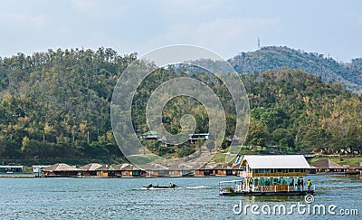Resort wooden home raft floating and mountain fog on river Stock Photo