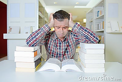 Resourceful reader with piles book Stock Photo