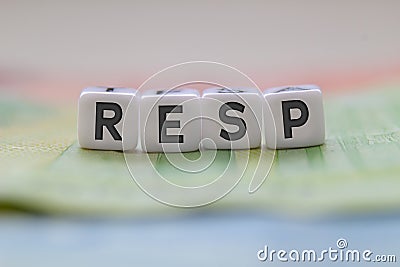 RESP letters on white blocks with bills on a clear background Stock Photo