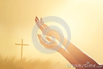 Respect and pray on the cross and nature sunset background Stock Photo
