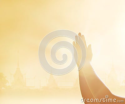 Respect and praying hands on the temple background Stock Photo