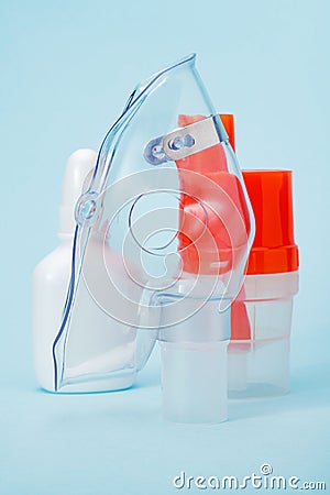 Respiratory mask and atomizing cup for compressor inhaler on blue Stock Photo