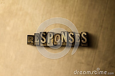 RESPONSES - close-up of grungy vintage typeset word on metal backdrop Stock Photo