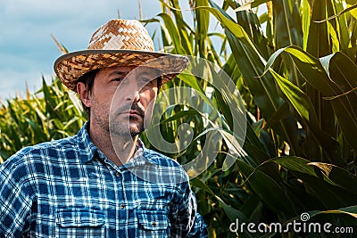Responsible corn farmer in field thinking Stock Photo