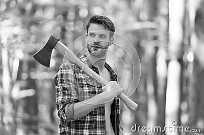 Responsible for the forest. man with axe in the forest. cutter going to cut tree. lumberjack holding ax in hands Stock Photo