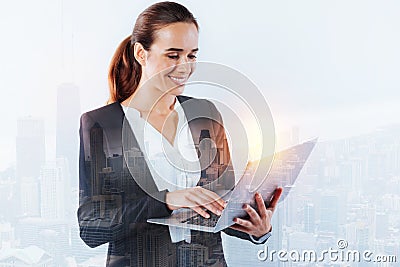 Responsible young specialist using a laptop at work Stock Photo