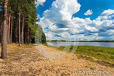 Rest on the birch pond. Forest colorful lake in clear weather. Camping by the lake Stock Photo