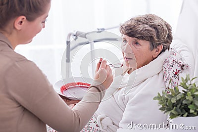 Rest home resident having care Stock Photo