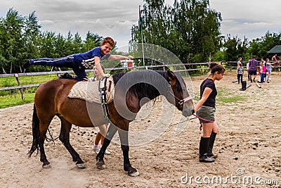Rest in the summer children`s equestrian camp in Ukraine Editorial Stock Photo