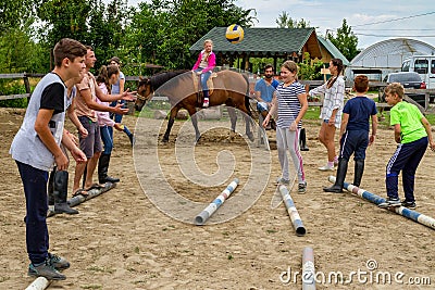Rest in the summer children`s equestrian camp in Ukraine Editorial Stock Photo