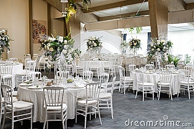 Restaurant banquet hall with served decorated wedding tables Editorial Stock Photo