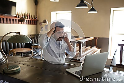 Restaurant, cafe, bar closed due to COVID-19 or Coronavirus outbreak lockdown, stressed owner of small business trying Stock Photo