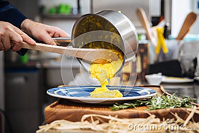 Restaurant chef cooking italian cuisine dish risotto Stock Photo