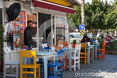 Restaurant with colorful chairs in Kas town, Turkey. Editorial Stock Photo