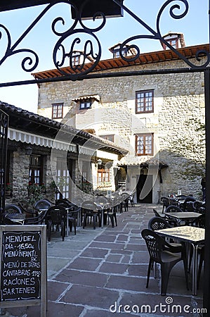 Santillana del Mar, 13th april: Restaurant Courtyard from Medieval Santillana del Mar town in Spain Editorial Stock Photo