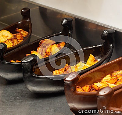 Restaurant dish of boat with fried potatoes in fryer, close-up Stock Photo