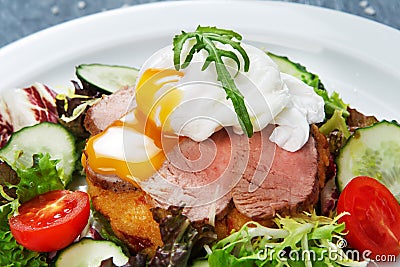 Restaurant food closeup, poached egg with meat Stock Photo