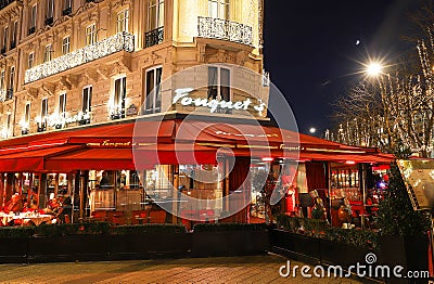 The restaurant Fouquets decorated for Christmas . It located at avenue Champs Elysees in Paris.Fouquets is a historic Editorial Stock Photo