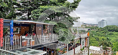 The restaurant is on a hill with direct views of the tree-lined nature getaway with an open theme. Editorial Stock Photo