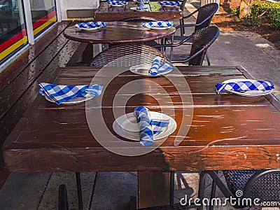 Restaurant Outside Seating With Dinner Plate Setup Stock Photo