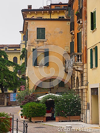 Restaurant in a quiet cobbled street, Verona, Italy Editorial Stock Photo