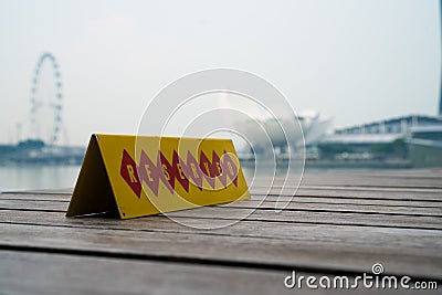 Restaurant reserved table sign with Singapore landscape in the background Stock Photo