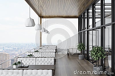 Restaurant on the roof, white sofas, cityscape Stock Photo