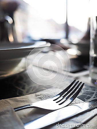 Restaurant scene, fork and knife on a clean table Stock Photo