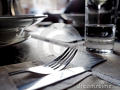 Restaurant scene, fork and knife on a clean table Stock Photo