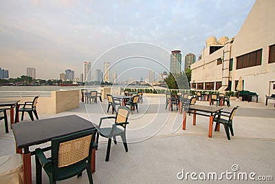 Restaurant seats and tables near the river, restaurant interior. Stock Photo