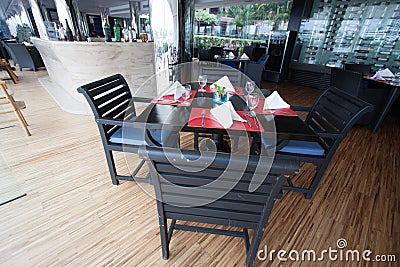 Restaurant seats and tables near the river, restaurant interior. Stock Photo