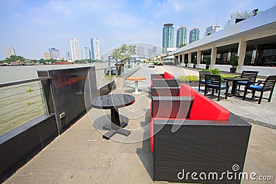 Restaurant seats and tables near the river, restaurant interior. Stock Photo