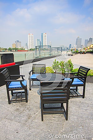 Restaurant seats and tables near the river, restaurant interior. Stock Photo