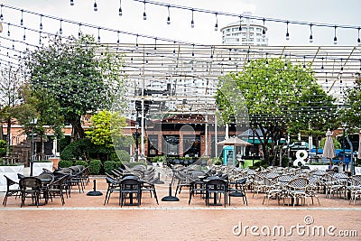 Restaurant table and chairs settings in outdoor dinning area during coronavirus restrictions waiting to reopen Stock Photo