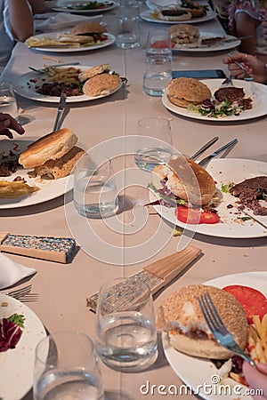 Restaurant table with children`s dishes after eating, leftovers Stock Photo