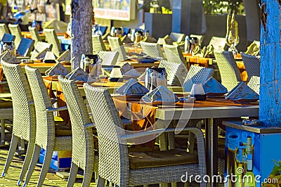 Restaurant tables and chairs on street Stock Photo