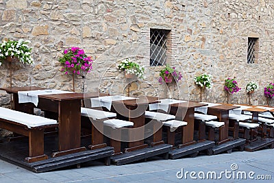 Restaurant tables on a street, Tuscany, Italy Stock Photo