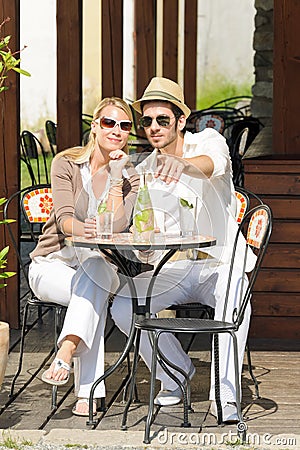 Restaurant terrace elegant couple drink sunny day Stock Photo