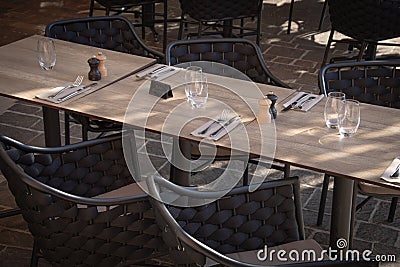 Restaurant terrace tables in the shade Stock Photo