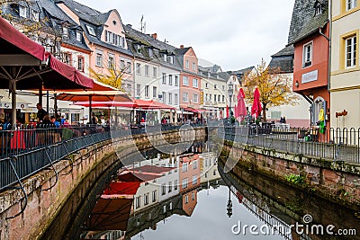 Restaurant terraces along the river Saar in the center of Saarburg, Germany Editorial Stock Photo