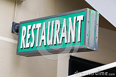 Restaurant text sign on bar building facade in street signboard Stock Photo
