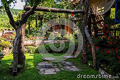 Restaurant in a vintage yard with wooden house, beautiful garden and much retro details Editorial Stock Photo